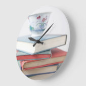 Grande Horloge Ronde Tea on book stack clock (Angle)