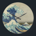 Grande Horloge Ronde The Great Wave off Kanagawa<br><div class="desc">This numberless wall clock features a very famous Japanese woodblock print called Kanagawa Okinami-Ura (神奈川沖浪裏), known in English under the name The Great Wave off Kanagawa. It was first printed during the 1830s by an artist named Katsushika Hokusai as a part of his Thirty-Six Views of Mount Fuji series.</div>