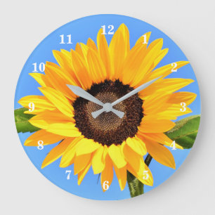 Grande Horloge Ronde Tournesol jaune contre soleil sur ciel bleu - été