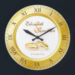 Grande Horloge Ronde Wedding Anniversary Gold<br><div class="desc">Simple, élégant clock en or tones, avec Roman numérique. The frame that functions as part of the clock is a frame for your favorite wedding photographe. Keep the sample image of a pair of gold and platinum wedding rings, or replace it with your own image for full personalization. Add your...</div>
