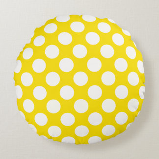 Grands pois blancs sur un coussin jeté jaune