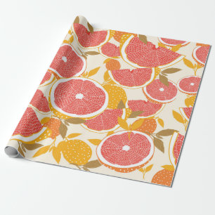 Grapefruit en halve snijwonden met bladeren op wit cadeaupapier