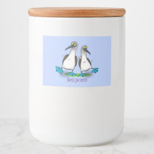 Grappig, gelukkig blauw gefundeerde cartoon die op voedselcontainer etiket