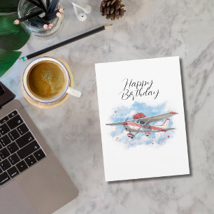 Grappig verjaardagsvliegtuig draagt bloemen en fot feestdagenkaart