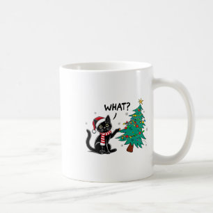 Grappig zwart kat dat kerstboom overspoelt boven k koffiemok