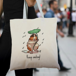 Grappige cavia houden glimlachende regen dansende  tote bag