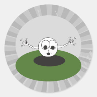 grappige golfbal die in een gat zit ronde sticker