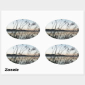Grassen op het Sunset-meer Ovale Sticker (Vel)