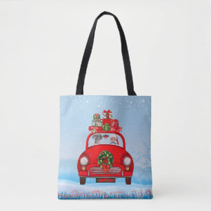 Great Dane-hond in auto met kerstman Draagtas