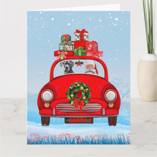 Great Dane-hond in auto met kerstman Kaart