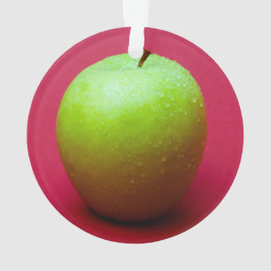 Green apple on red background