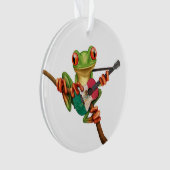 Grenouille d'arbre jouant le blanc de guitare de (devant)