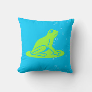 grenouilles vertes sur un oreiller bleu