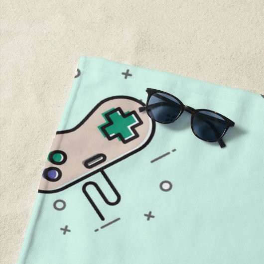 Grey game joystick op blauw strandlaken (In situ)