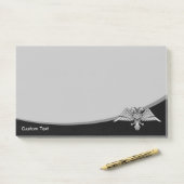 Grijze arend met twee koppen post-it® notes (Op bureau)