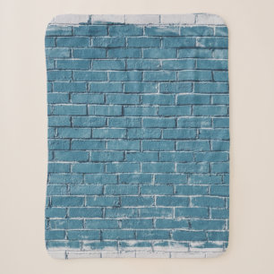 Grijze betonstenen verven in blauw sherpa deken