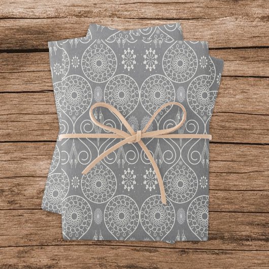 Grijze vezelige textiel octopus zaden met patronen inpakpapier vel