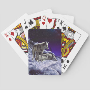 Grijze wolven in wintersneeuw bij nacht pokerkaarten