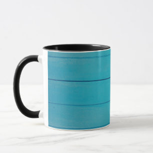 Groen getextureerd wandpatroon met turquoise mok