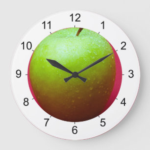 Groene appel op rode achtergrond grote klok