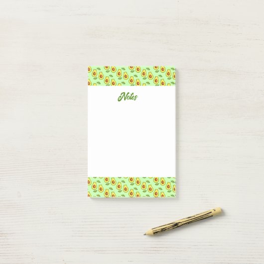Groene avocado kat post-it® notes (Op bureau)