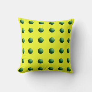 Groene bollen op geel kussen