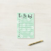 Groene en witte palmbladeren om te doen lijst post-it® notes (Op bureau)