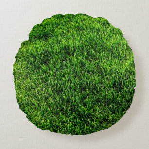 Groene grastextuur van een voetbalveld rond kussen