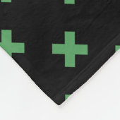 Groene kruisstiften op zwart fleece deken (Hoek)