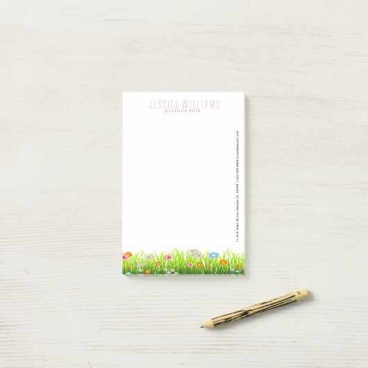 Groene lentegranen en kleurrijke bloemen post-it® notes (Op bureau)