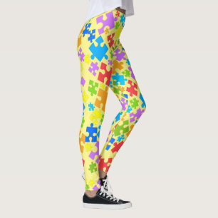 Grote paaskleurautisme puzzelstukjes op gele gloed leggings