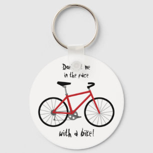 "Hak me niet in het gezicht met een bike!" Sleutelhanger