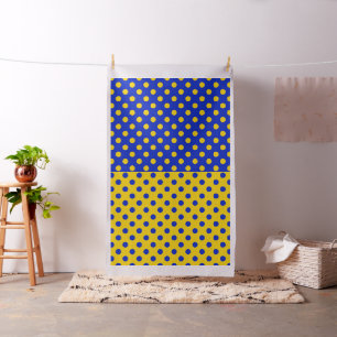 Half blauw en geel stippenpatroon stof