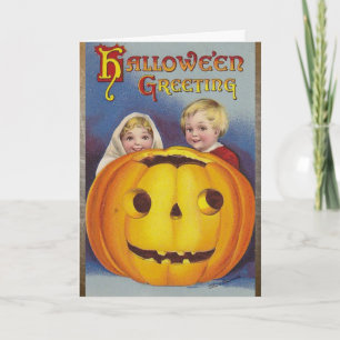 Halloween Greetings. Kinderen met pompoenkaart Kaart