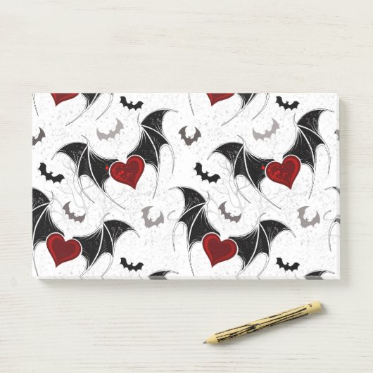 Halloween hart met zwarte vleermuisvleugels post-it® notes (Op bureau)