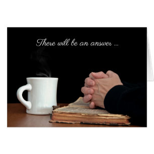 Handen bidden op oude bijbel