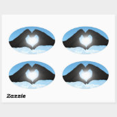 Handen in Heart Shape Silhouette op Blue Sky Ovale Sticker (Vel)