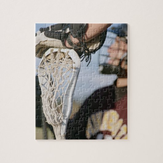 Handje op een Lacrosse Stick Legpuzzel (Verticaal)