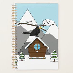 Happy Blackbird chanter dans le paysage hivernal
