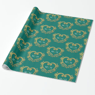 Hart-monogram van goud op donkergroene trouw cadeaupapier