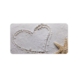 Hartelijk gedraaid in zand bij Beach w Starfish Sj Etiket