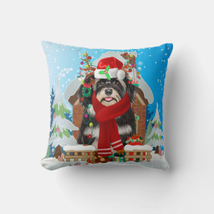Havanese hond met kerstcadeaus kussen