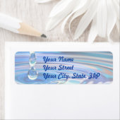 Heldere blauwe waterdruppels stromend etiket (Insitu)