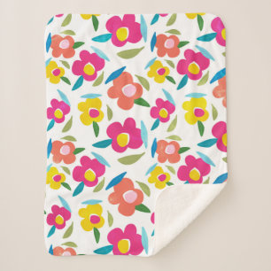 Heldere bloemen op wit sherpa deken