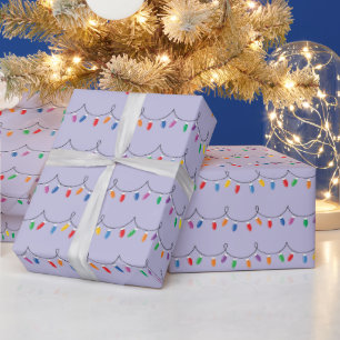 Heldere kleurrijke kerstverlichting gloeit naadloo cadeaupapier