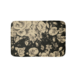 Heldere  oliebloemen op zwart badmat