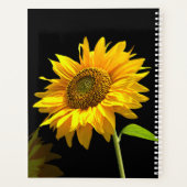 Heldere zonnebloem op zwarte achtergrond planner (Achterkant)