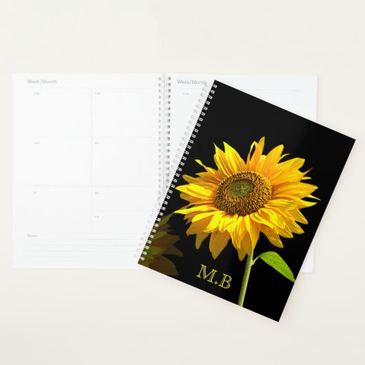 Heldere zonnebloem op zwarte achtergrond planner (Display)