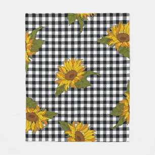 Heldere zonnebloemen op een zwarte en witte buffel fleece deken