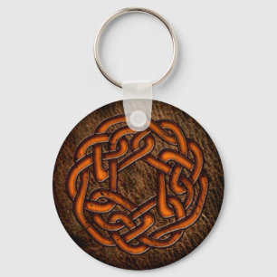 Helderheid oranje knobbel op leder sleutelhanger